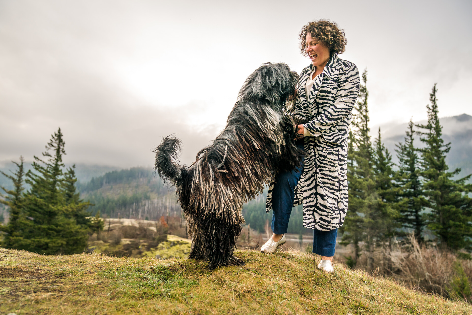 Woman dancing with her Bergamasco dog