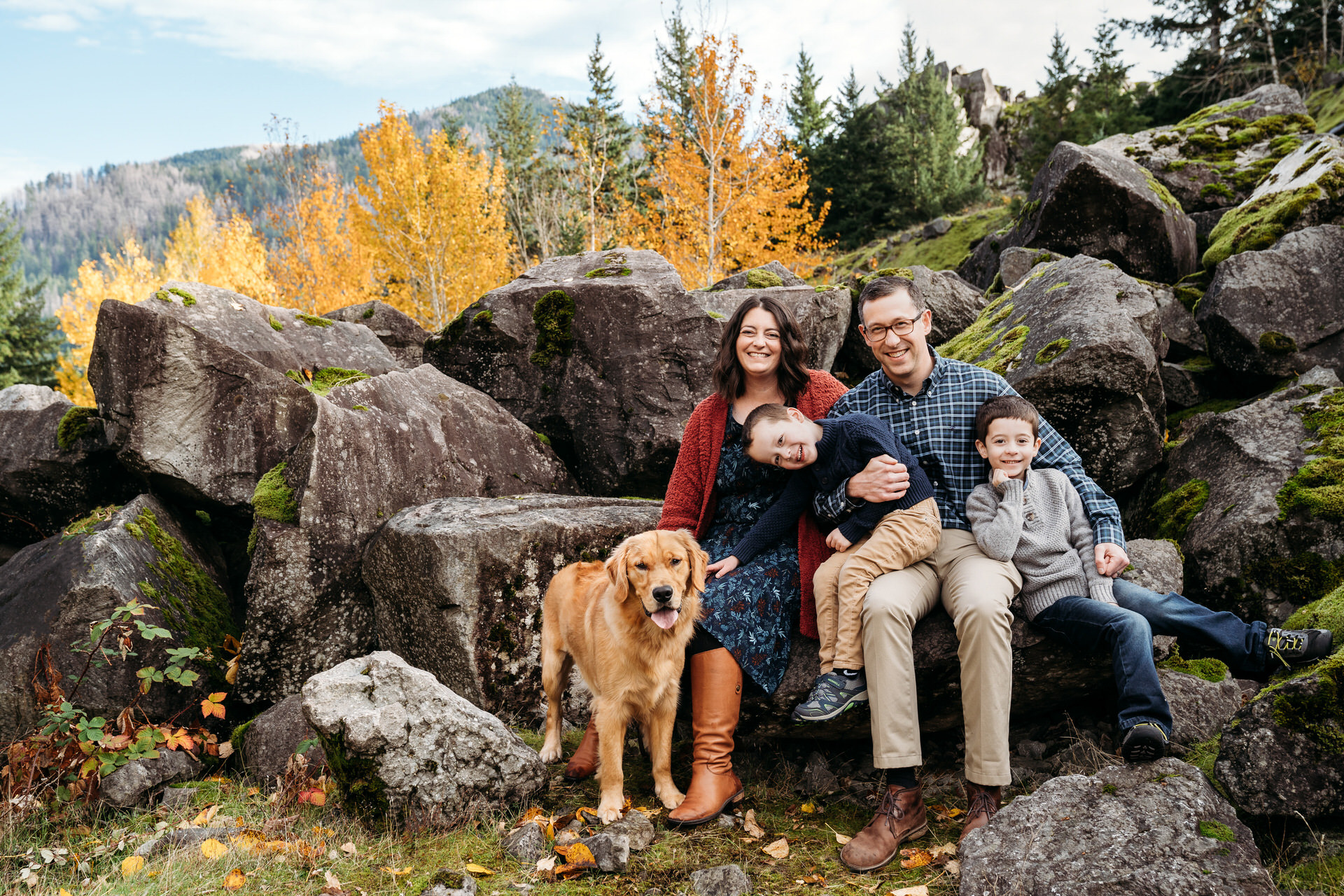 Family photos in autumn outside of Portland Oregon with their golden retriever dog