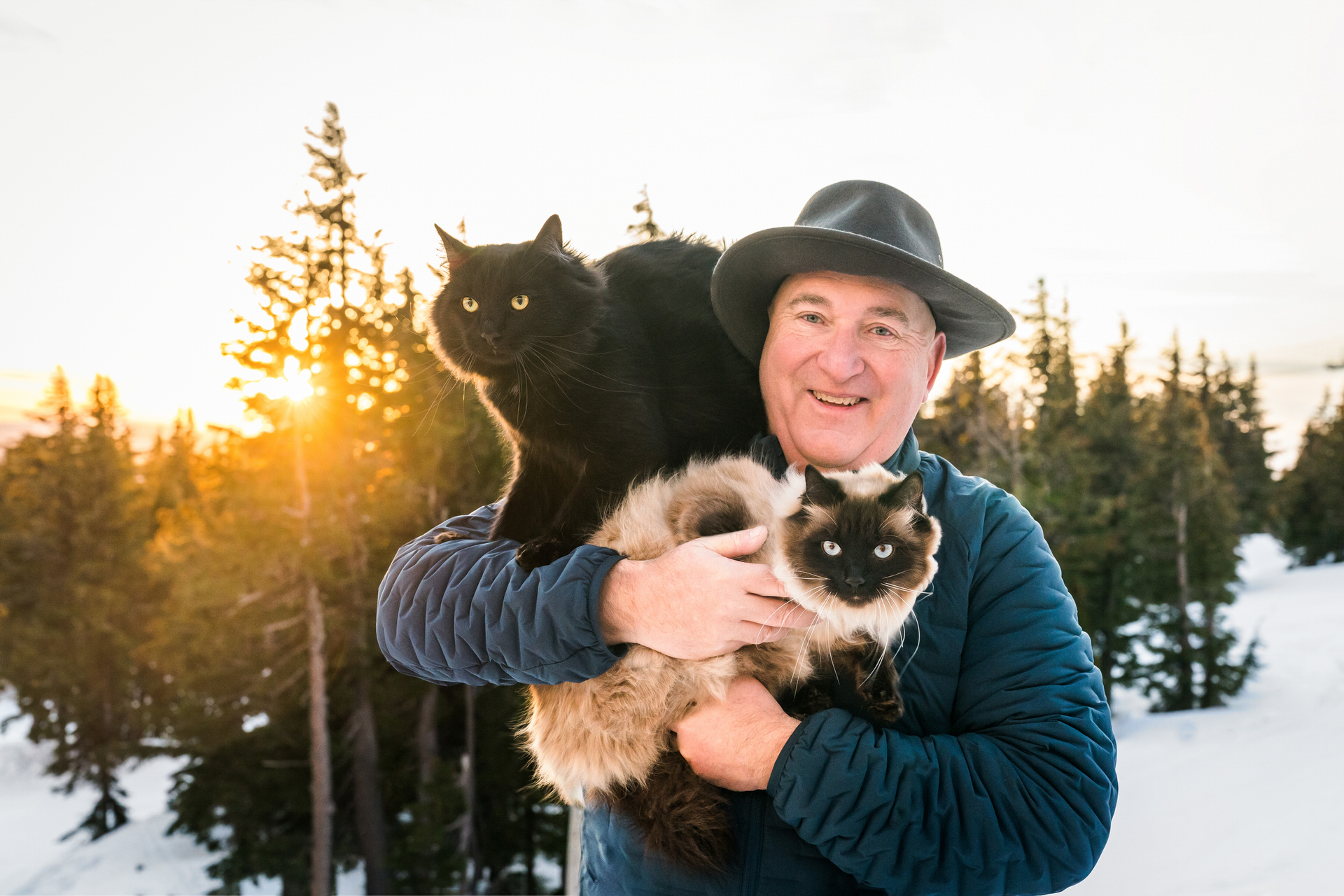 Man holding his adventure cats